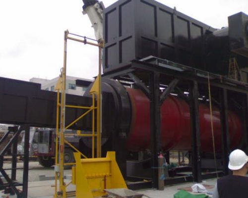 Rotary incinerator with automatic ram charger loading system