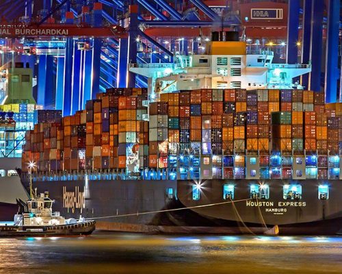 A large shipping container with Incoterms