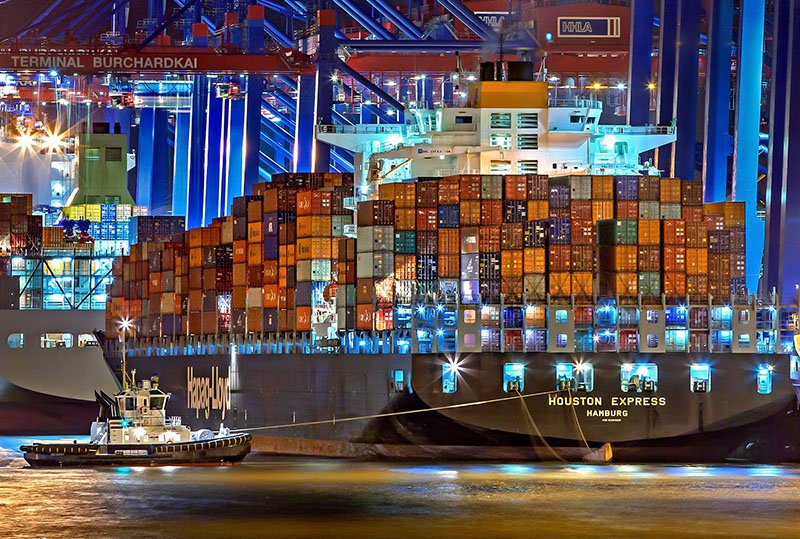 A large shipping container with Incoterms