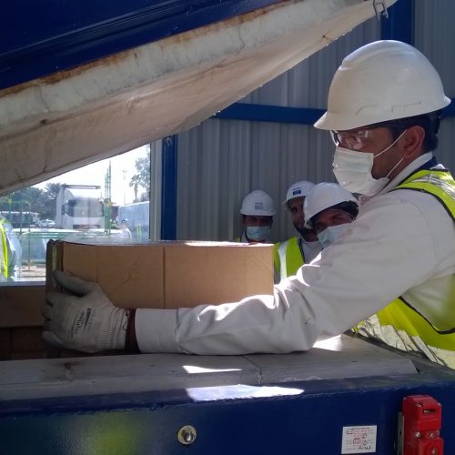 Waste box being loaded into a blue addfield incinerator