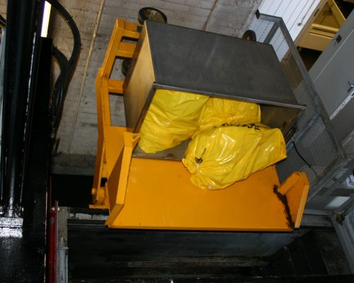 Bin tipper loading medical waste bags