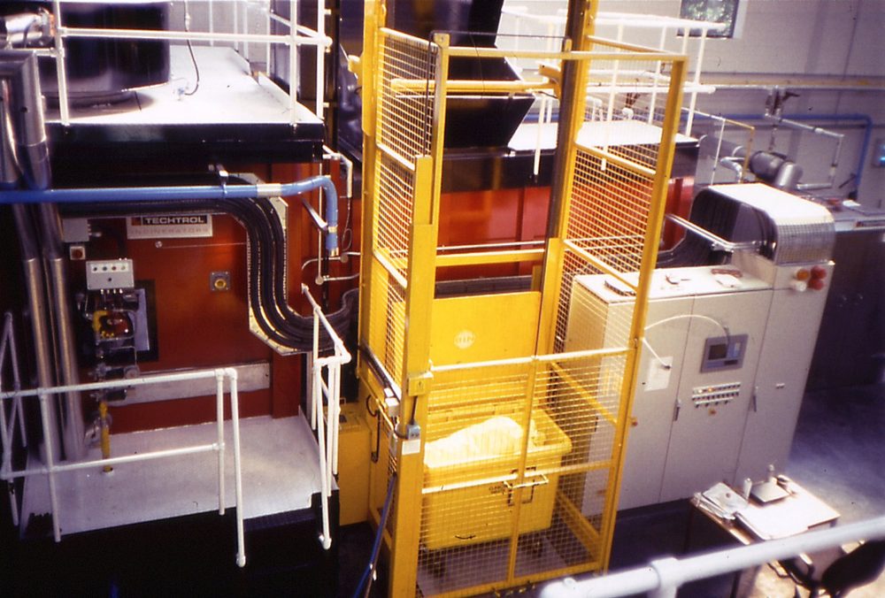 Bin tipper feature attached to a large scale incinerator