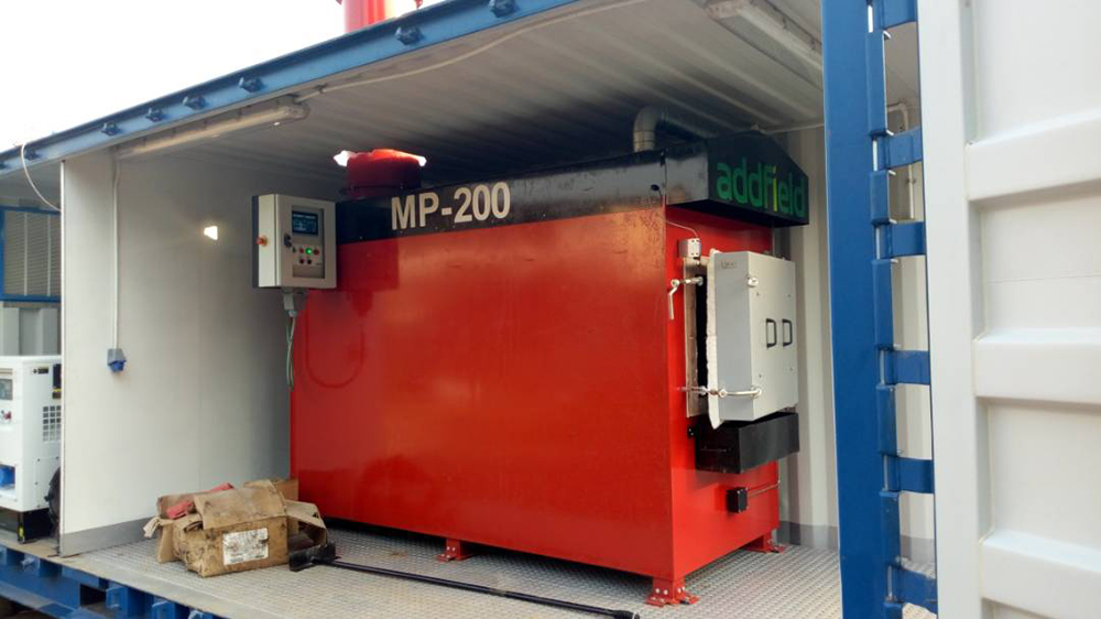 Red Incinerator for medical waste in a container ready to use