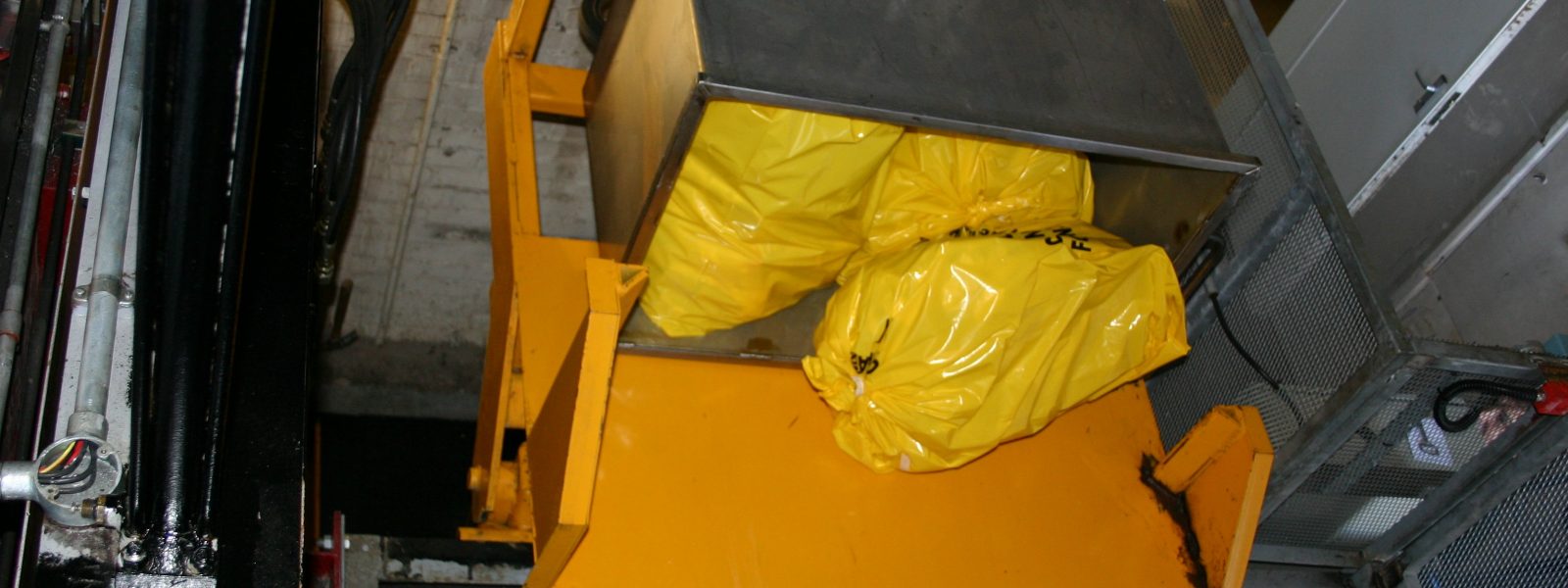 Yellow bag waste in a bin tipper
