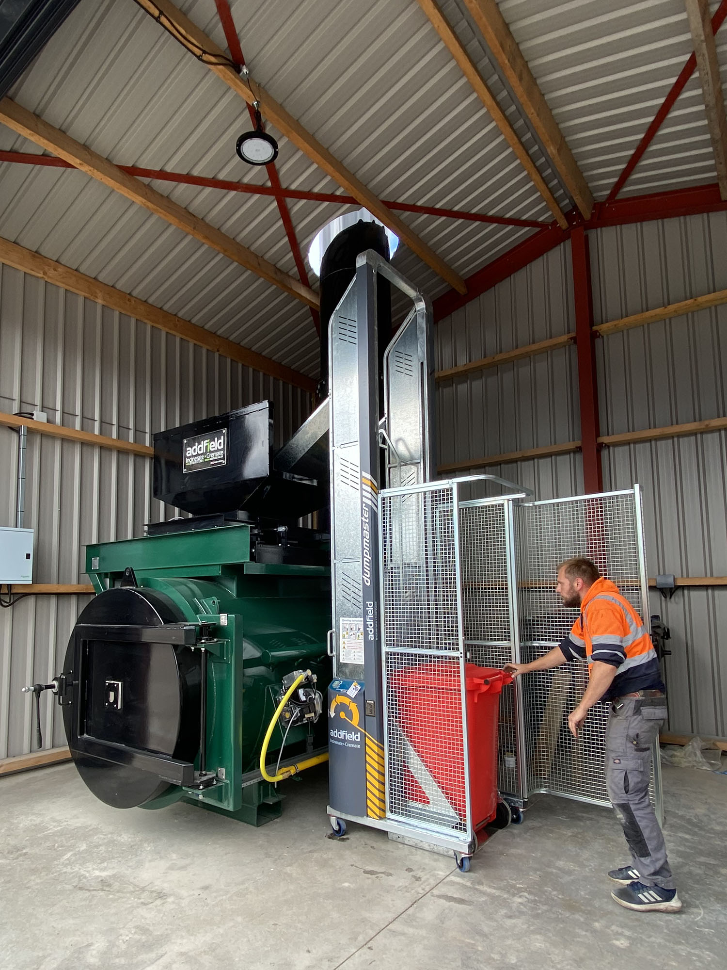 Agricultural incinerator being loaded