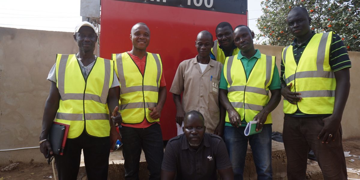 Photo of team following installation of machine.