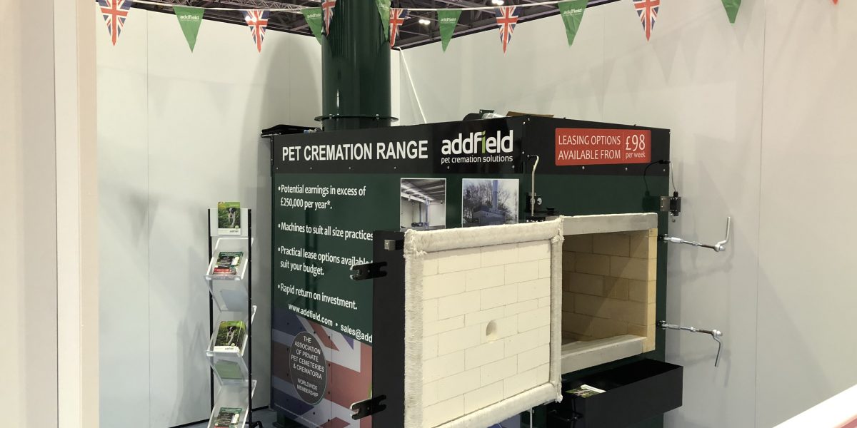 PET-100 cremator with advertisement stickers at london vet show 2018