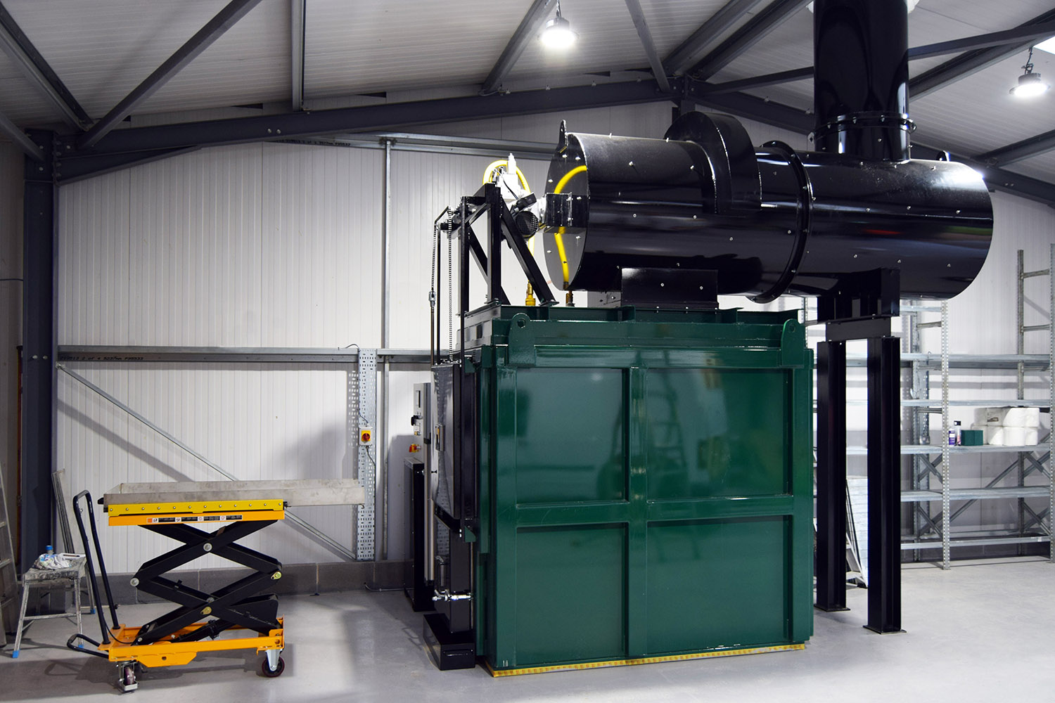 A pet crematorium with a hydraulic lifting table