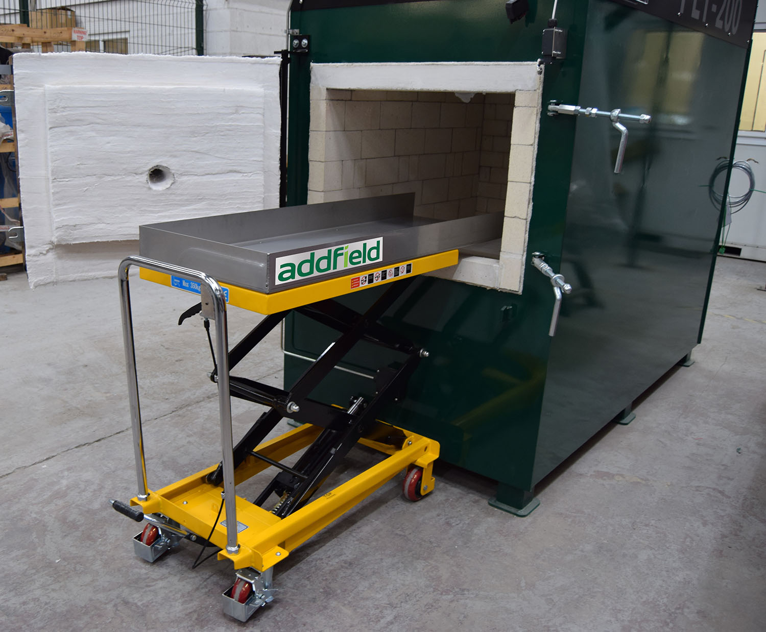 Pet 200 and lifting table placing a pet inside a cremator