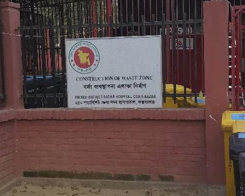 Medical Waste for Aid Agency Sign on Fence