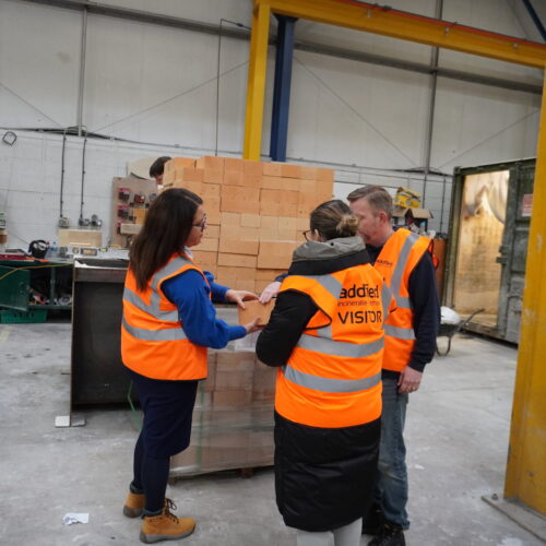 Looking at premium quality bricks in tour of Addfield's factory