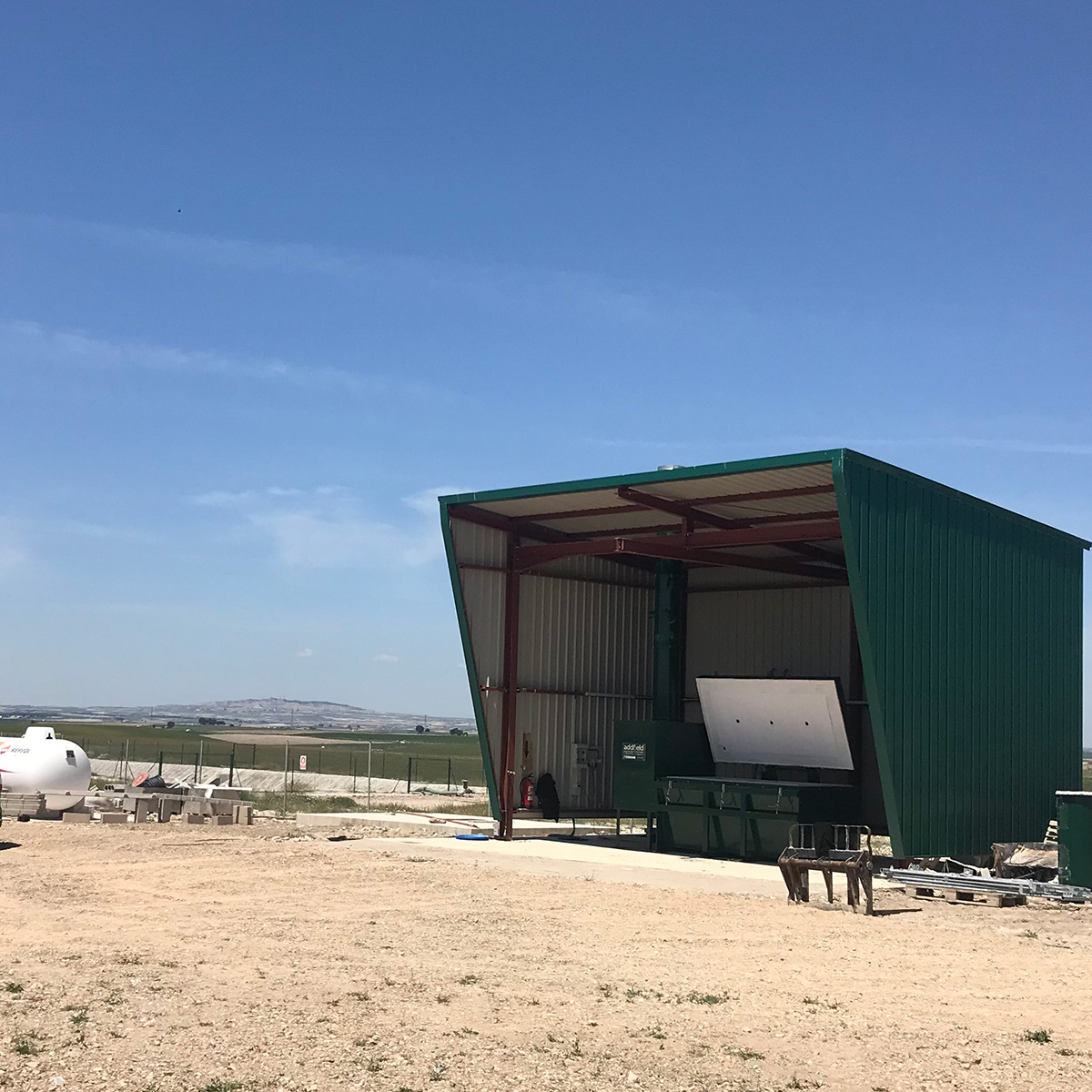animal incinerator located in a remote field in a weather shelter